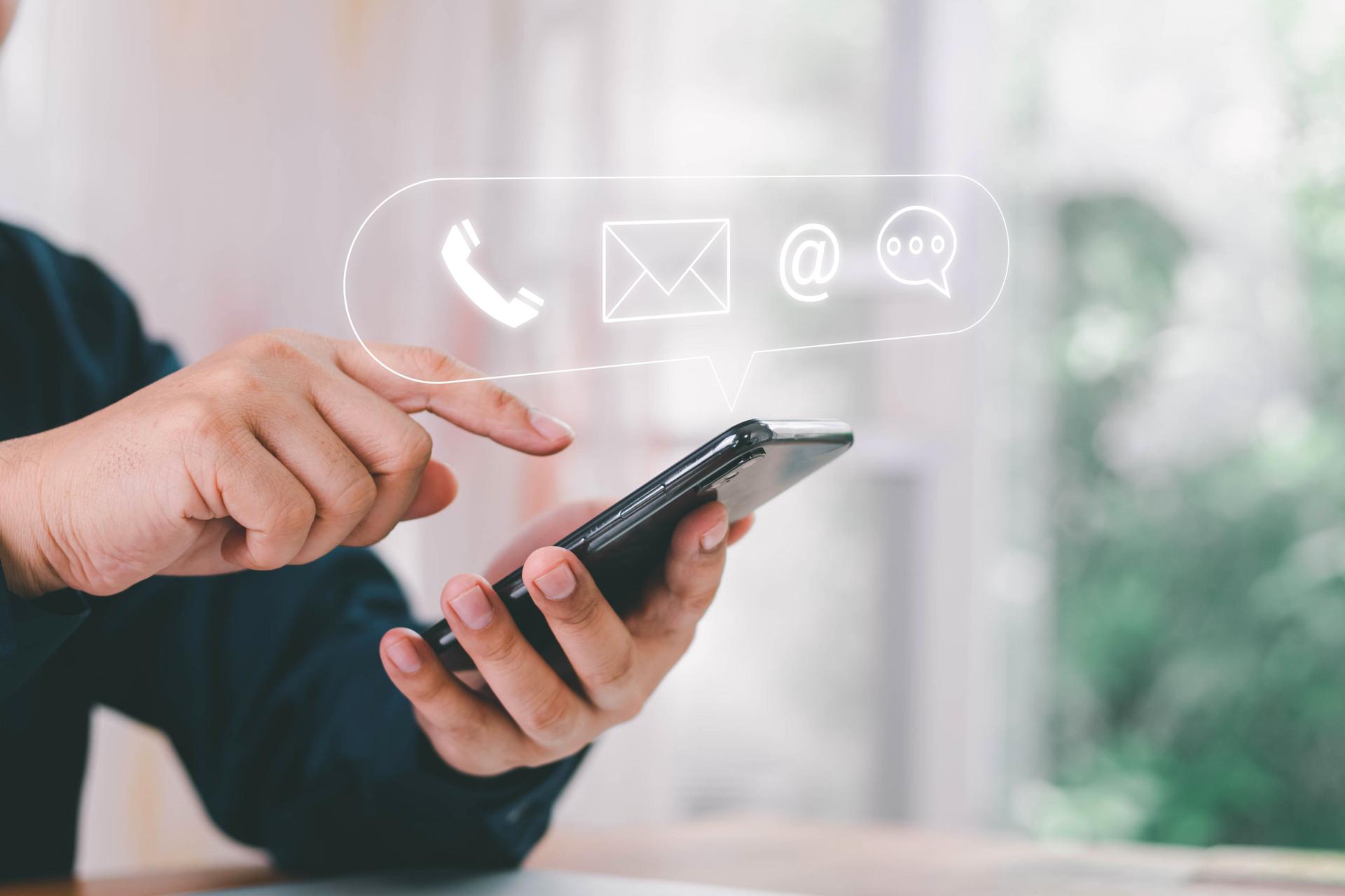 Concept of contact us, customer support, service, icon, Contact us or Customer support hotline people connect. Businessman using a laptop with the (email, call phone, mail) icons. customer service.